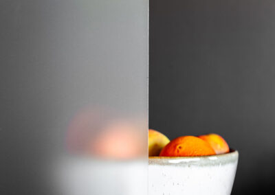 Bowl of fruits behind frosted glass